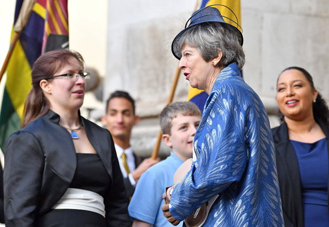 Britain’s Prime Minister Theresa May (centre) leaves after attending a Commonwealth Day Service at Westminster Abbey, in central London, on Monday (AFP photo)