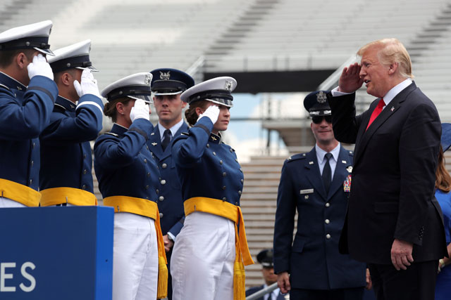 US President Donald Trump salutes cadets as he participates in graduation ceremonies at the US Air Force Academy commencement in Colorado Springs, Colorado, US, on Thursday (Reuters photo)