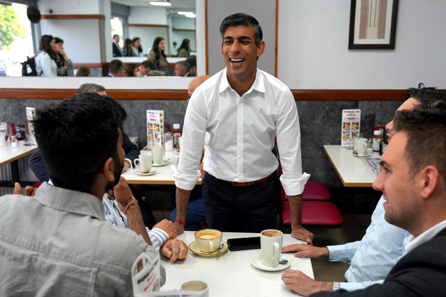 Britain’s Prime Minister Rishi Sunak addresses Conservative party members and supporters at a cafe in Ruislip, on Friday (AFP photo)