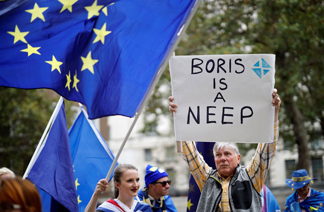 Anti-Brexit activists, and demonstrators opposing the British government's actions in relation to the handling of Brexit, protest near Downing Street in central London, on Tuesday (AFP photo)