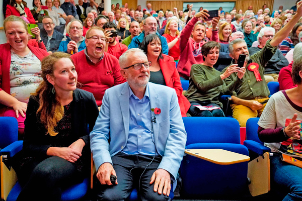 Britain’s Labour Party leader Jeremy Corbyn (centre) sits with Labour parliamentary candidate for Gloucester Fran Boait  as he joins a local campaign launch event in Gloucester, at University of Gloucestershire Oxstalls Campus, on Saturday (AFP photo)