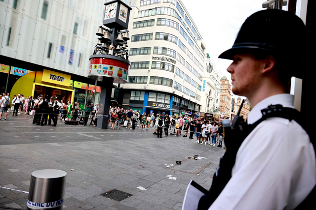 A photograph taken on Monday shows a police officer standing by a cordoned off area in Leicester square, London (AFP photo)