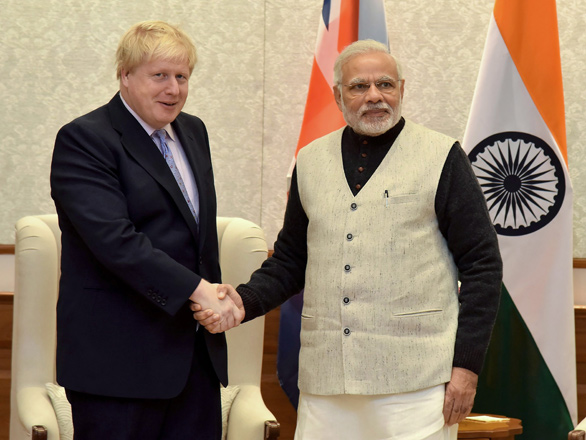 In this photograph released by the Press Information Bureau (PIB) on January 18, 2017, former British foreign secretary Boris Johnson (left) shakes hands with Indian Prime Minister Narendra Modiv  in New Delhi (AFP photo)