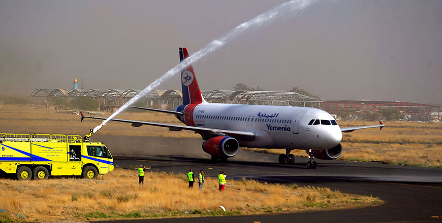A Yemenia plane, the first commercial flight in nearly six years from Yemen's rebel-held capital, gets a water salute as it prepares to take off from Sanaa airport on Monday (AFP photo by Mohammed Huwais)