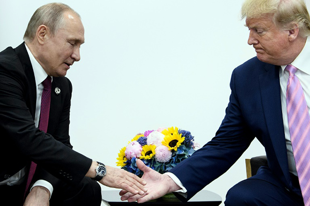 Russia's President Vladimir Putin is likely to ask US President Donald Trump for lifting sanctions on Moscow during their phone call expected on Monday (AFP photo)