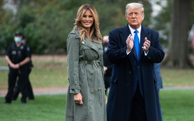US President Donald Trump and First Lady Melania Trump walk to Marine One prior to departing from the South Lawn of the White House in Washington, DC, on Tuesday, as they travel to campaign (AFP photo)