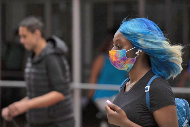 A woman walks through downtown Manhattan, New York City, on Saturday  (AFP photo)