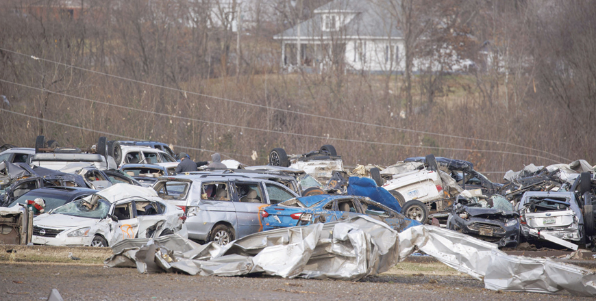 Emergency crews search through the flattened Mayfield Consumer Products building in Mayfield, Kentucky, on Saturday (AFP photo)