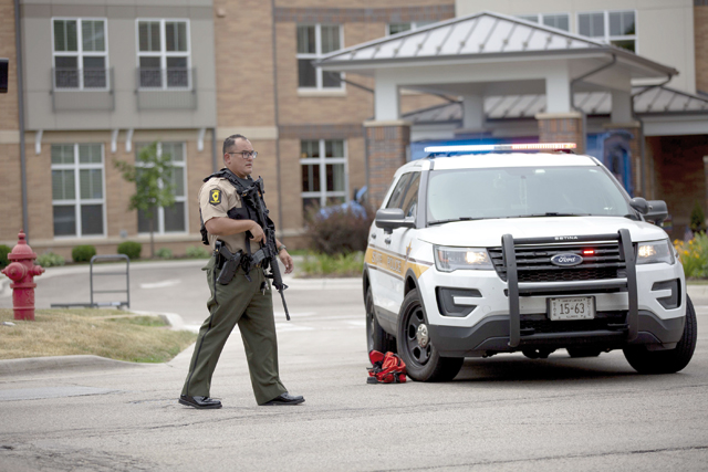 First responders work the scene of a shooting at a Fourth of July parade on Monday in Highland Park, Illinois (AFP photo)