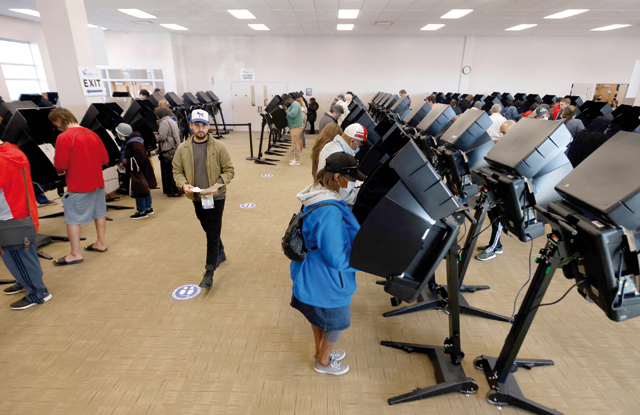 Voters cast their ballots for early voting at the Franklin County Board of Elections, on the eve of the US midterm elections, in Columbus, Ohio, on Monday (AFP photo)