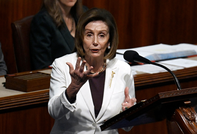 Outgoing US Speaker of the House of Representatives Nancy Pelosi (centre), Democrat of California, speaks in the House Chamber at the US Capitol in Washington, DC, on Thursday (AFP photo)