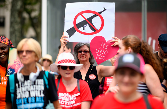 In this file photo taken on August 18 protesters take part in a rally of ‘Moms against gun violence’ and calling for Federal Background Checks in New York City (AFP photo)