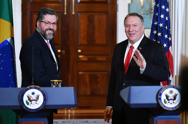 US Secretary of State Mike Pompeo (right) and Brazilian Foreign Minister Ernesto Araujo turn to depart after delivering statements to the press following a meeting at the State Department in Washington, DC, on Friday (AFP photo)