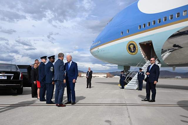 US President Joe Biden (centre) is greeted upon arrival at Kirtland Air Force Base in Albuquerque, New Mexico, on Tuesday (AFP photo)