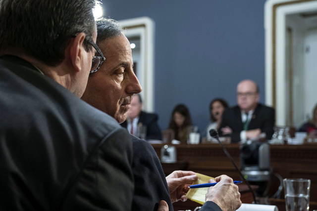 House Judiciary Committee member Rep. Jamie Raskin (D-MD) (centre) confers with counsel during a House Rules Committee hearing concerning the articles of impeachment against US President Donald Trump, at the US Capitol in Washington, DC, on Tuesday (AFP photo)