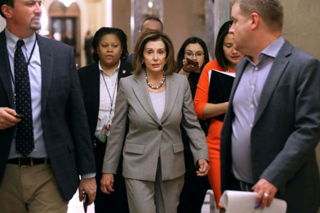 US House Speaker Nancy Pelosi, seen walking to her office on Friday, said House impeachment hearings produced enough evidence to convict President Donald Trump (AFP photo)