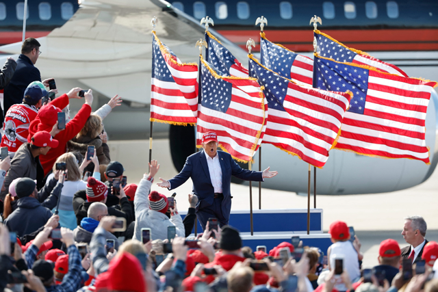 Former US president and Republican presidential candidate Donald Trump gestures as he arrives for a Buckeye Values PAC rally in Vandalia, Ohio, on Saturday (AFP photo)
