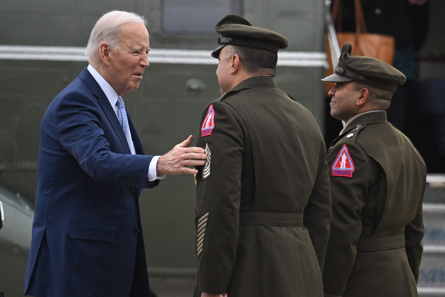 US President Joe Biden greets Lieutenant Colonel Tribhuwan Singh and Command Sergeant Major Pablo Cortez as he arrives at Delaware Air National Guard Base in New Castle, Delaware, on Friday (AFP photo)