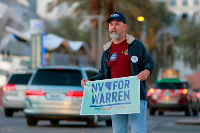 Steve Omelia campaigns outside the site of Democratic presidential candidate Massachusetts Senator Elizabeth Warren campaign rally on the eve of Nevada Democratic Caucus in Las Vegas, Nevada, on Friday (AFP photo)