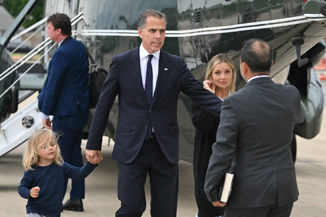 Hunter Biden (centre) walks with his son Beau and his wife Melissa Cohen Biden on the tarmac of Delaware Air National Guard Base in New Castle, Delaware, after the arrival of US President Joe Biden on Tuesday (AFP photo)