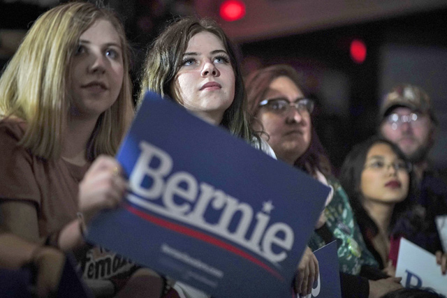 Supporters listen as Democratic presidential candidate Sen. Bernie Sanders (I-VT) speaks during a campaign rally at Cowboys Dancehall on Saturday in San Antonio, Texas (AFP photo)