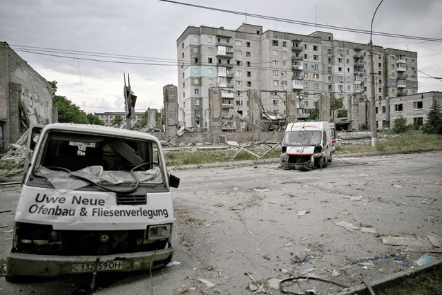 Destroyed vehicles are photographed in the city of Lysychansk in the eastern Ukrainian region of Donbas on Saturday amid the Russian invasion of the country (AFP photo)