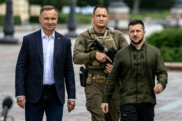 Ukraine's President Volodymyr Zelensky and Poland's President Andrzej Duda  arrive to attend their joint press conference in Kyiv on Tuesday (AFP photo)