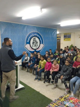 In this photo taken on Saturday, local students prepare to receive their certificates after completing an eight-week English language course  (Photo by Alexander Werman)