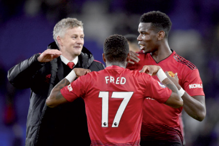 Manchester United’s Paul Pogba (right) celebrates after the match with interim manager Ole Gunnar Solskjaer on Saturday (Reuters photo)