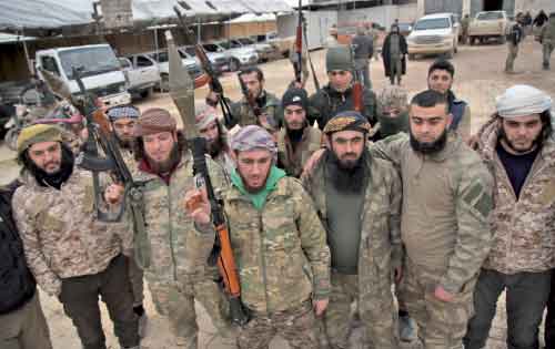 Turkish-backed Syrian fighters participating in a training manouevre, gather near the town of Tal Hajar in Aleppo’s province, a few kilometres from areas controlled by a Kurdish-led coalition, on Wednesday (AFP photo)