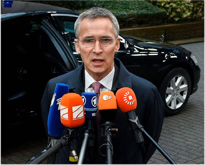 NATO Secretary General Jens Stoltenberg answers journalists' questions during a defence council meeting at the EU headquarters in Brussels on Tuesday (AFP photo)