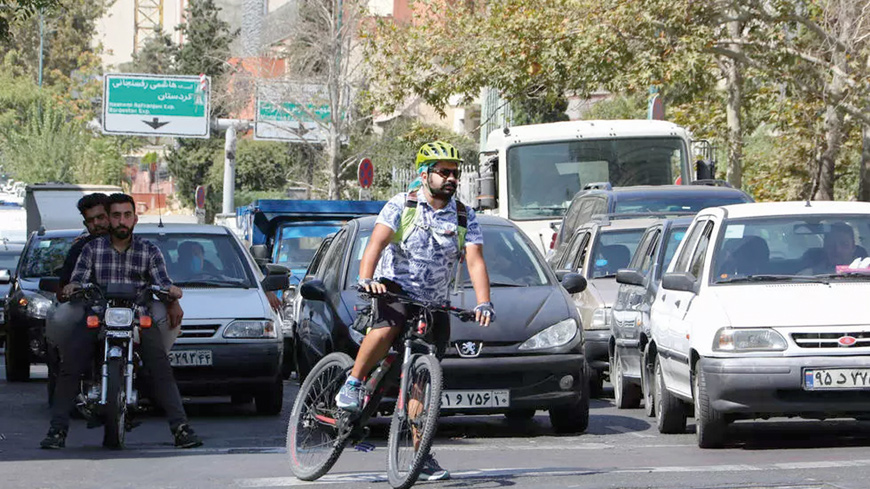   Farshad Rezayi, a 32-year-old chef, rides over 30 kilometres a day to get to and from work in Iran’s capital Tehran  (AFP photo)