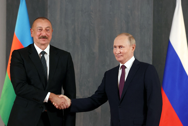 Russian President Vladimir Putin meets with Azerbaijan's President Ilham Aliyev on the sidelines of the Shanghai Cooperation Organisation leaders' summit in Samarkand on Friday (AFP photo)