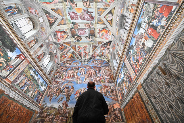 A man visits the Sistine Chapel on the reopening day of the Vatican Museum on Monday in Vatican City (AFP photo)
