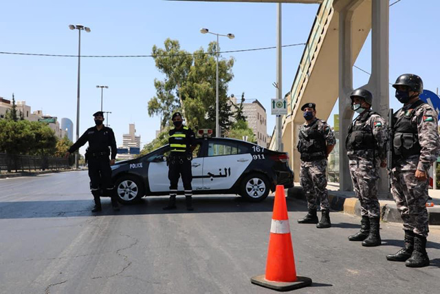 Police officers are seen manning a street in Amman in this photo taken on August 28, 2020 (Photo by Amjad Ghsoun)