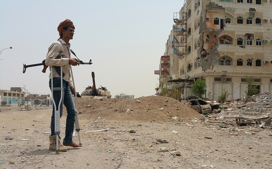 A fighter loyal to Yemen's exiled President Abed Rabbo Mansour Hadi walks with crutches in Yemen's second city of Aden on Thursday (AFP photo)