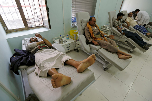 People donate blood at a blood transfusion centre in Sanaa, Yemen, on Monday (Reuters photo)