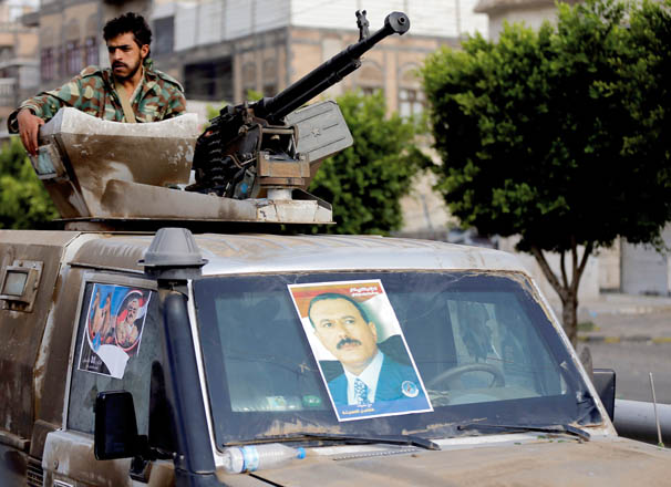 A soldier loyal to Yemen’s former president Ali Abdullah Saleh mans a machinegun mounted on a military truck securing the vicinity of the site of a rally held to mark the 35th anniversary of the establishment of his General People’s Congress Party led by Saleh in Sanaa, Yemen, on Thursday (Reuters photo)