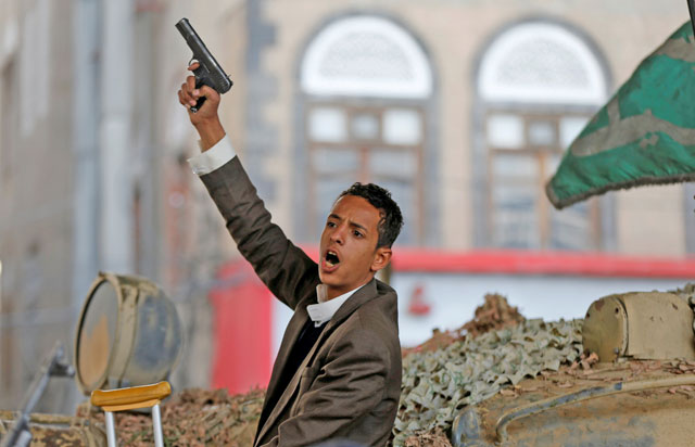 A Houthi militant reacts after the death of Yemen's former president Ali Abdullah Saleh in Sanaa, Yemen, on Monday (Reuters photo)