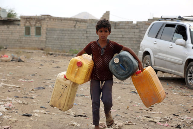A Yemeni child carries empty jerrycans amid continuing wide spread disruption of water supply in the impoverished coastal village on the outskirts of the Yemeni port city of Hodeidah on Monday (AFP photo)