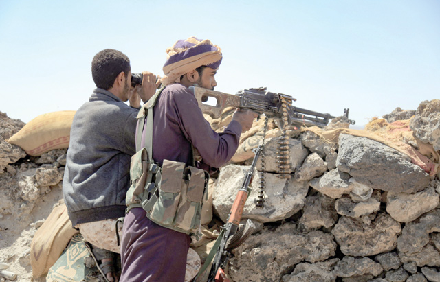 Fighters loyal to Yemen's Saudi-backed government man a position near the frontline facing Iran-backed Houthi rebels in the country's north-eastern province of Marib, on Sunday (AFP photo)
