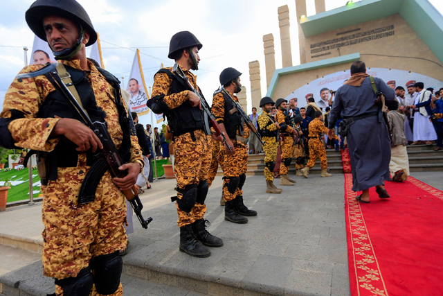 Fighters loyal to Yemen's Houthi rebels visit the grave of slain Houthi political leader Saleh Al Sammad at Al Sabeen Square in the capital Sanaa, on April 8 (AFP photo)