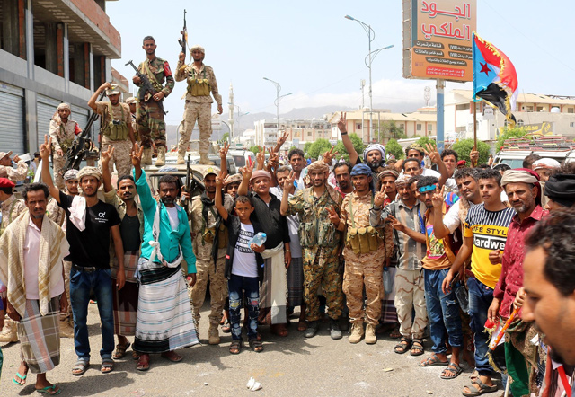 Yemeni southern separatists supporters wave a flag of the former South Yemen (The People’s Democratic Republic of Yemen) as they demonstrate in the Khormaksar district of Yemen’s second city of Aden on Thursday  (AFP photo)