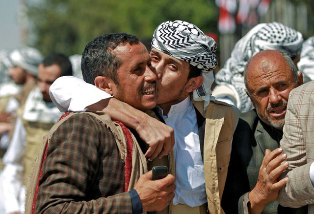 Freed Yemeni Houthi prisoners are greeted by relatives at the airport of Sanaa, after being released as the country began swapping 1,000 prisoners in a complex operation overseen by the International Committee of the Red Cross (AFP photo)