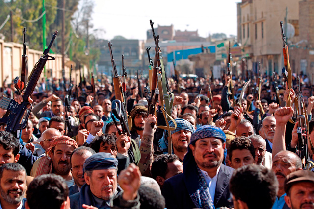 Supporters of Yemen's Houthi movement gesture as they chant slogans during a demonstration against the outgoing US administration's decision to designate the Iran-backed rebels as terrorists, in the capital Sanaa, on Wednesday (AFP photo)