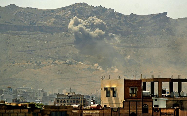 Smoke billows following a reported air strike by the Saudi-led coalition in the Yemeni capital Sanaa, on July 1, 2020  (AFP photo)