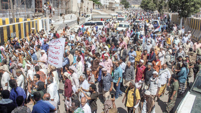 Protesters gather to demonstrate against deteriorating services and economic conditions, outside the internationally-recognised Yemeni government’s headquarters at Al Maashiq Palace in the Crater district of the southern port city of Aden, on Tuesday (AFP photo)