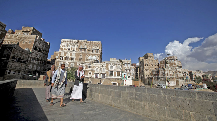 People walk in the old quarter of Yemen’s capital Sanaa on Tuesday (Reuters photo)