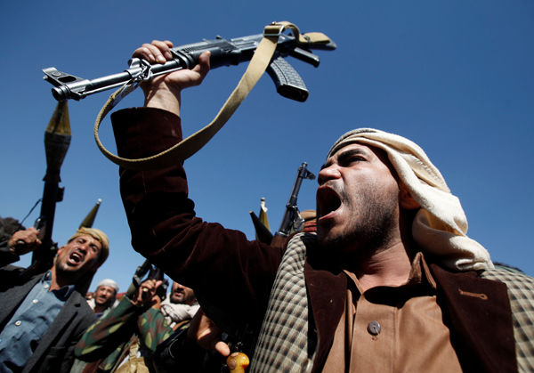 Pro-Houthi tribesmen shout slogans during a gathering held to mobilise fighters for battles against government forces in Sanaa, Yemen, on November 24 (Reuters photo)