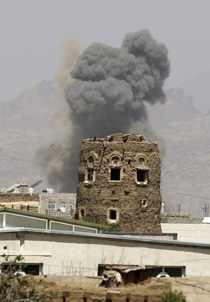 Smoke billows from buildings after reported air strikes by the Saudi-led coalition on arms warehouses at Al Dailami air base, controlled by Yemeni Iran-backed Shiite Houthi rebels and their allies, on Sunday, north of the capital Sanaa (AFP photo)